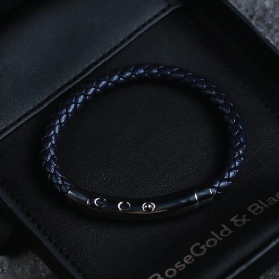 Navy Leather Bracelet - Our Navy Leather Bracelet features a Woven Leather Bracelet and an Adjustable Stainless Steel Clasp Engraved with our Signature RG&B Logo.